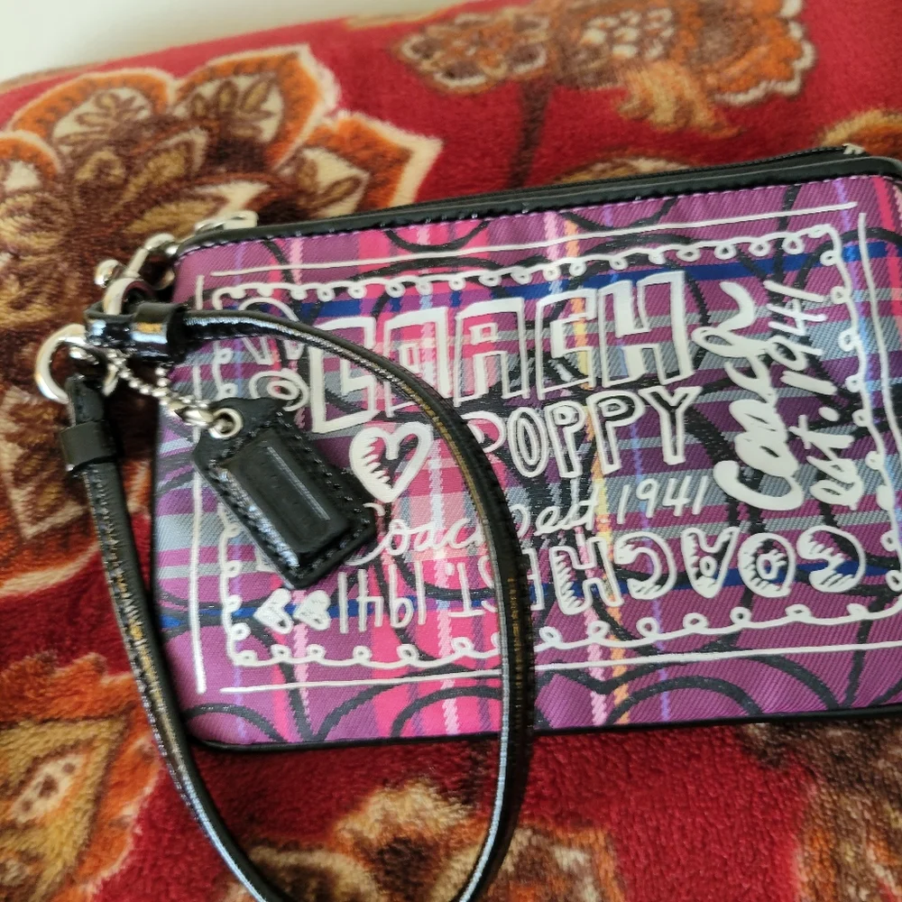 Coach Poppy tartan wristlet in pink and purple.